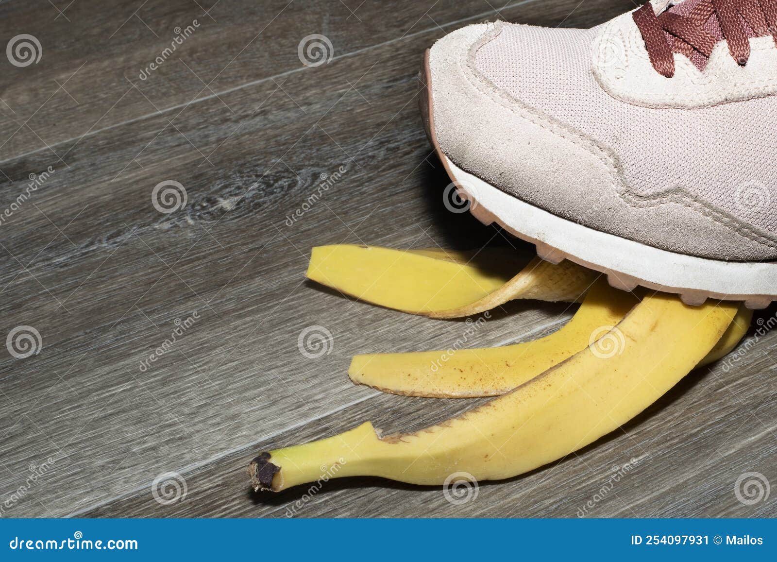 Foot Crushing a Banana Peel on a Wooden Floor Stock Image - Image of ...