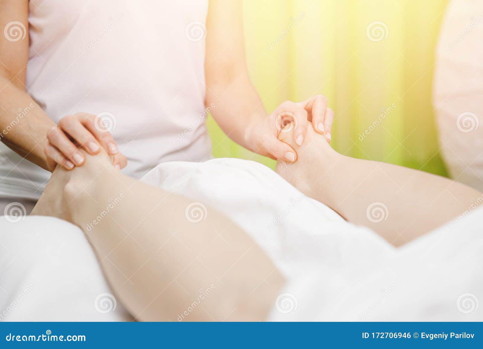Foot And Heel Legs Massage Of Young Women Beauty Spa Stock Photo