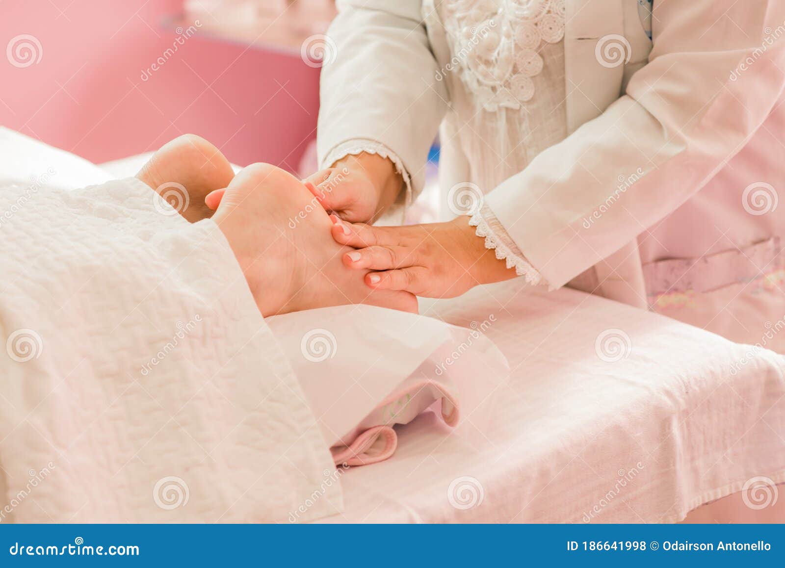 Foot Massage Therapy, with Specialized Professional. Stock Photo
