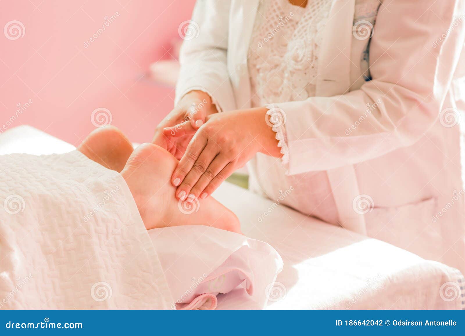Foot Massage Therapy, with Specialized Professional. Stock Photo