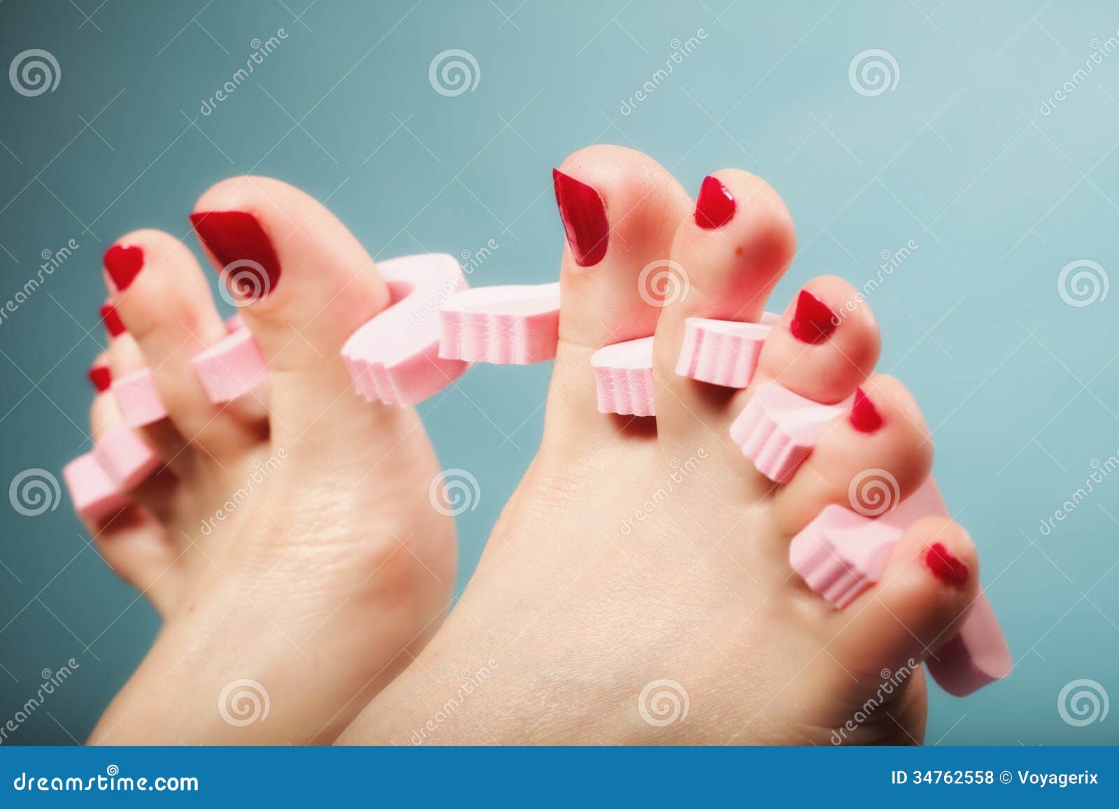 Foot Pedicure Applying Red Toenails on Blue Stock Photo - Image of ...