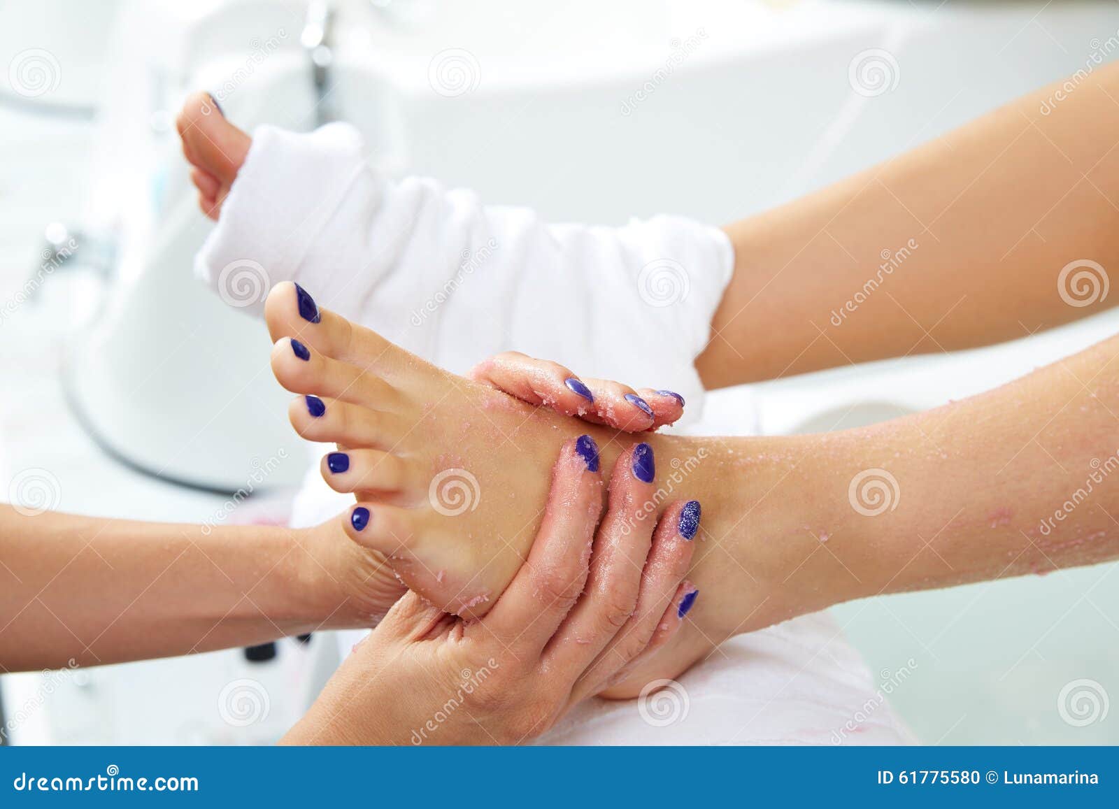 foot scrub pedicure woman leg in nail salon