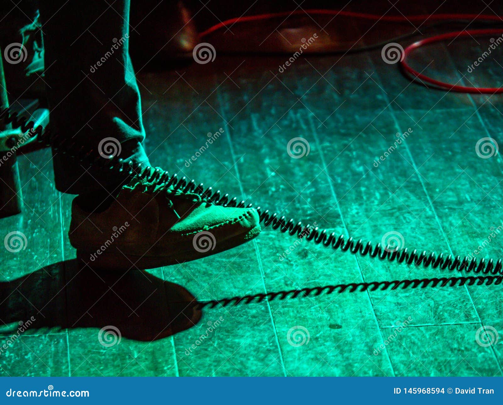 Foot Tapping in Rhythm of Musical Performance in a Dimly Lit Stage