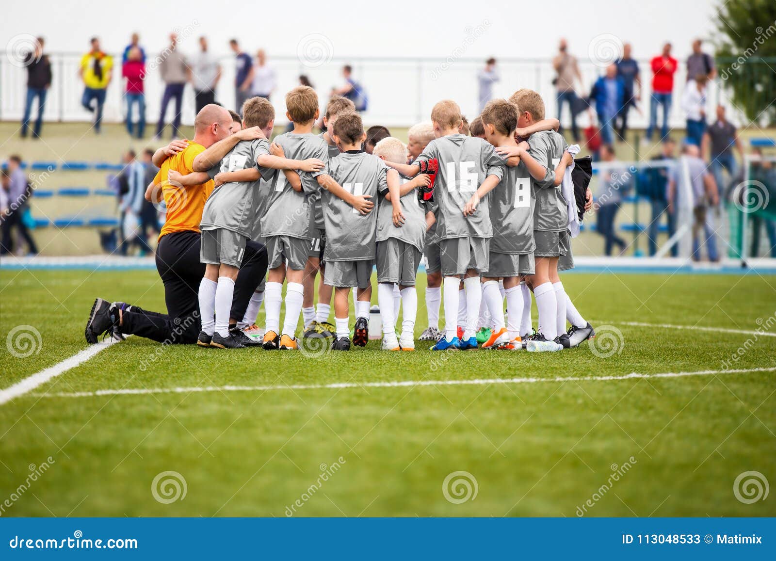 Coach Is Coaching Children Training In Soccer Team Stock Photo, Picture and  Royalty Free Image. Image 65309590.