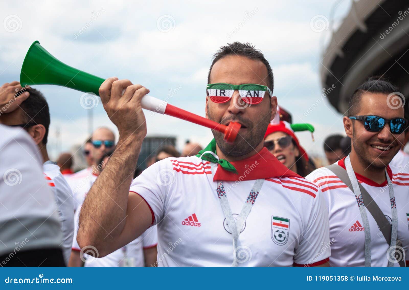 Football Fan of Iran at 2018 World Cup in Russia with Pipe and Color Glasses Editorial Stock Photo