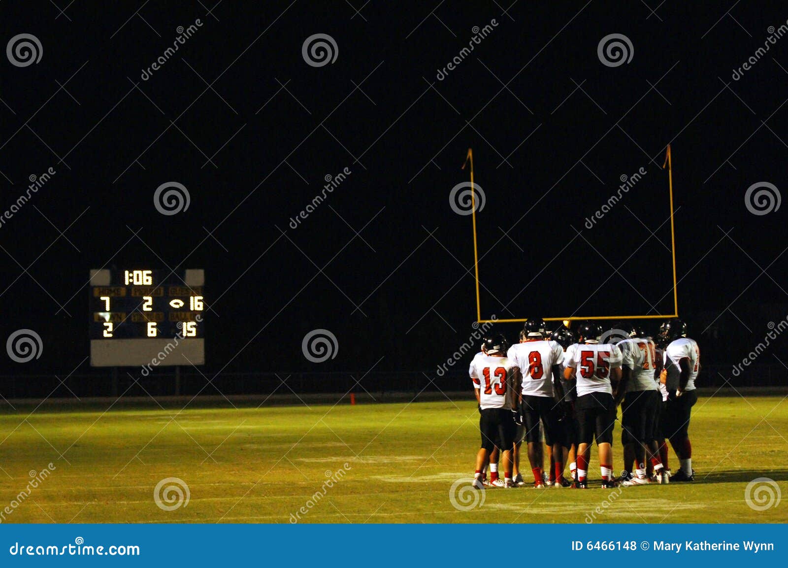 football huddle at night game
