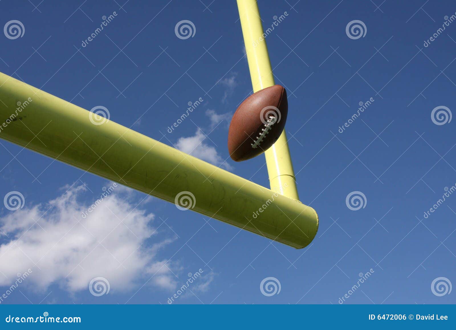 football kicked through the uprights