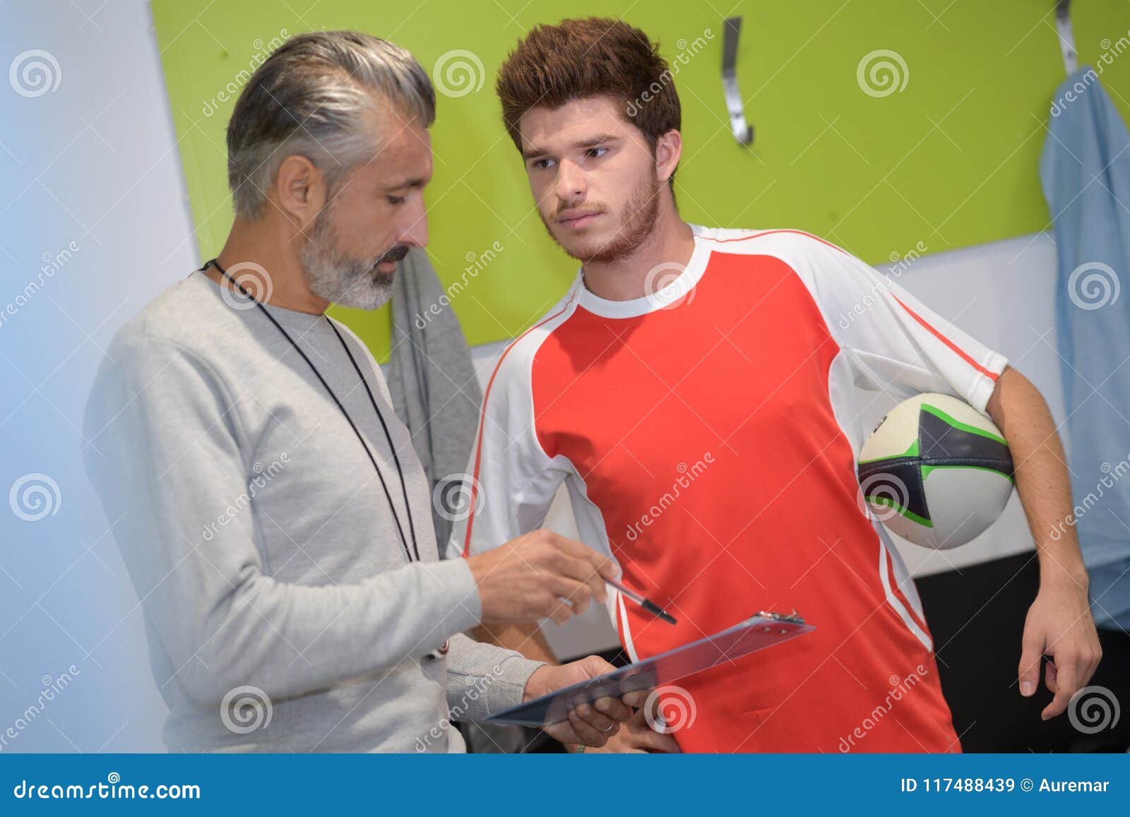 Football Player and Coach in Locker Room Stock Image Image of showing