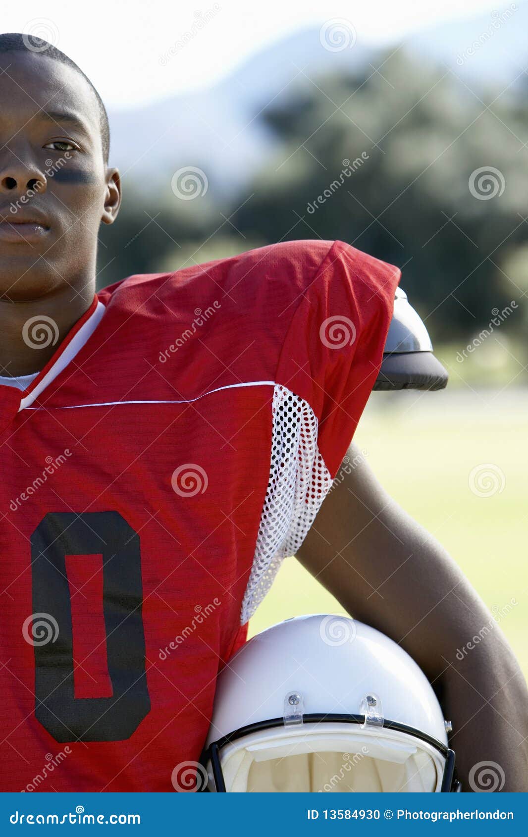 Football Player Holding Helmet on Field Stock Photo Image of training