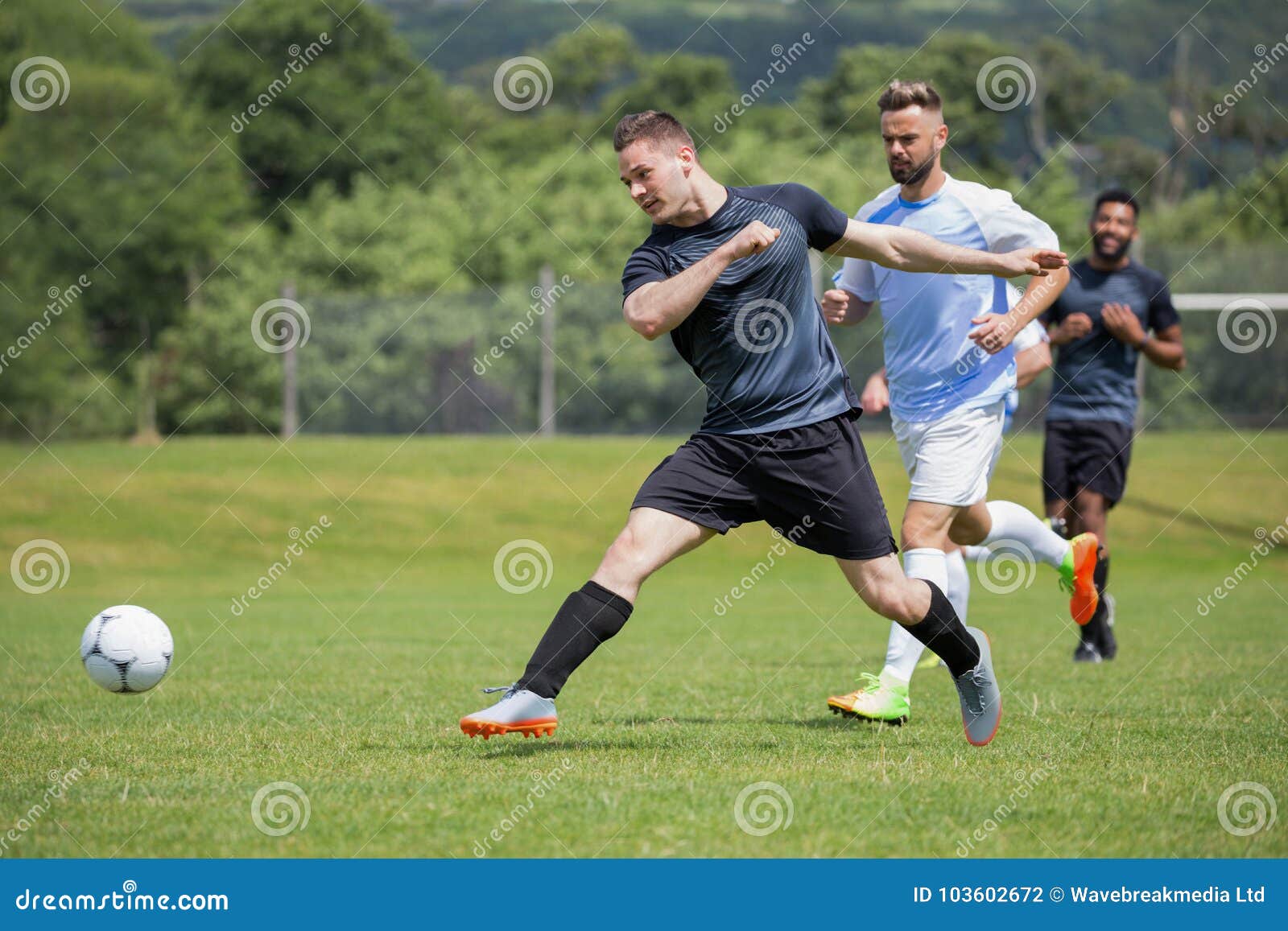 Football Players Playing Soccer in the Ground Stock Photo - Image of