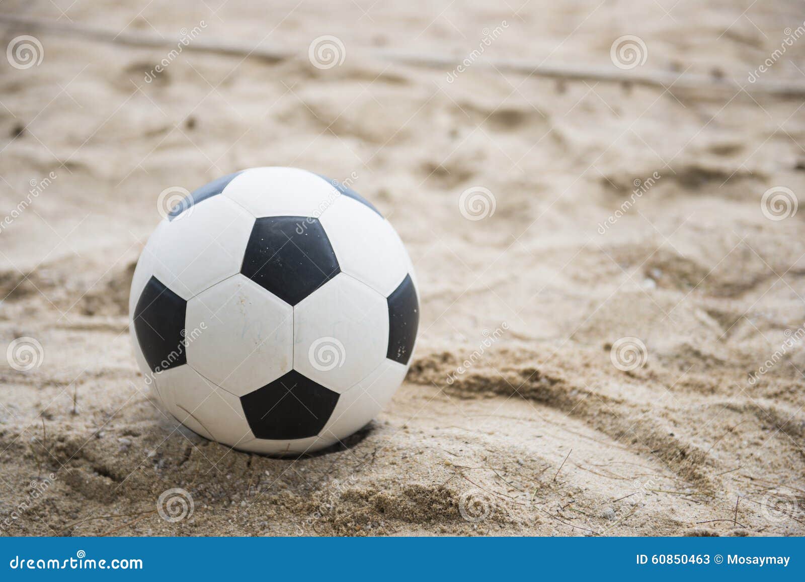 Football on sand beach stock image. Image of black, soccer 60850463