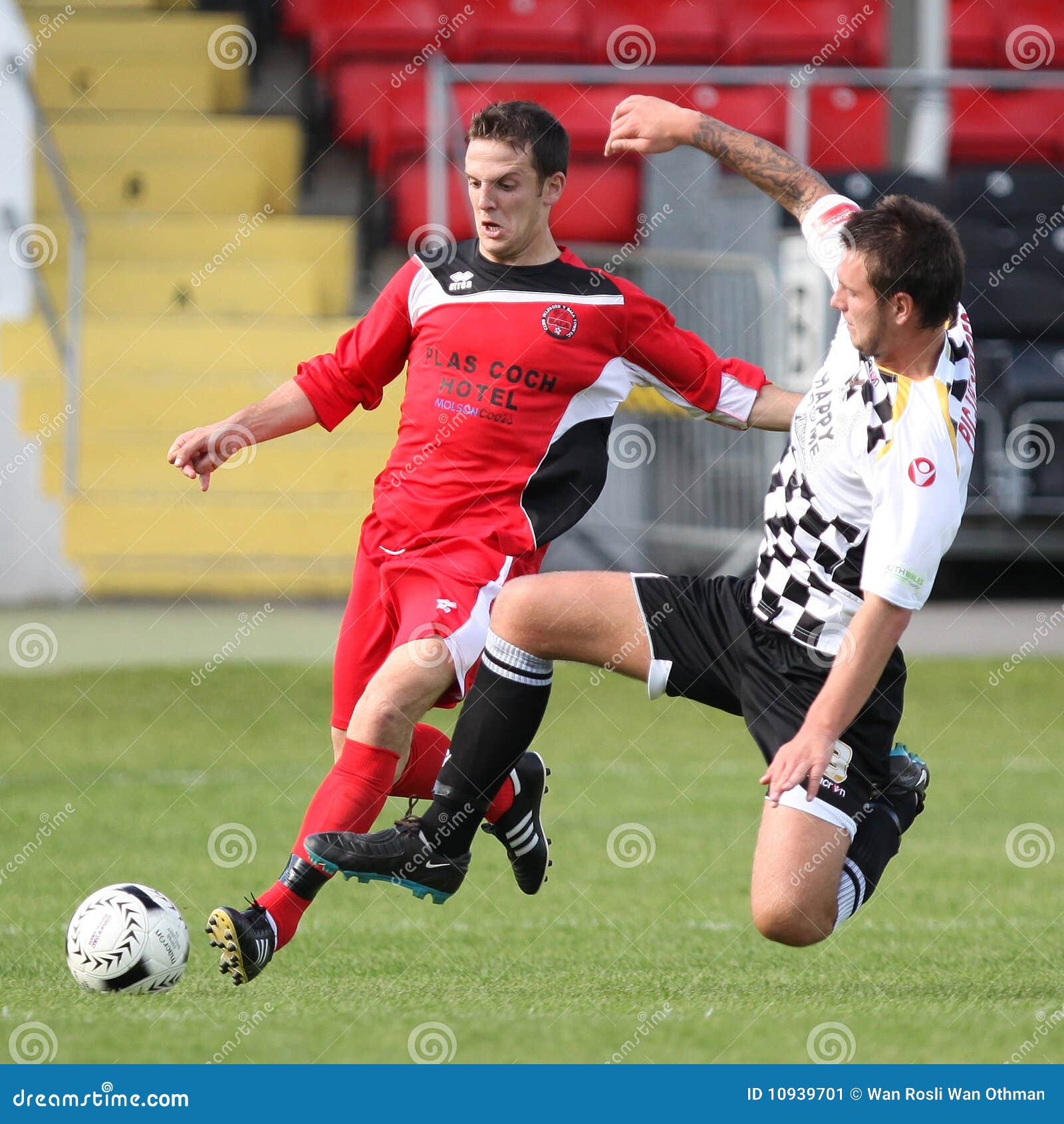 Young footballer in control of the ball on a Astra Turf pitch Stock Photo -  Alamy