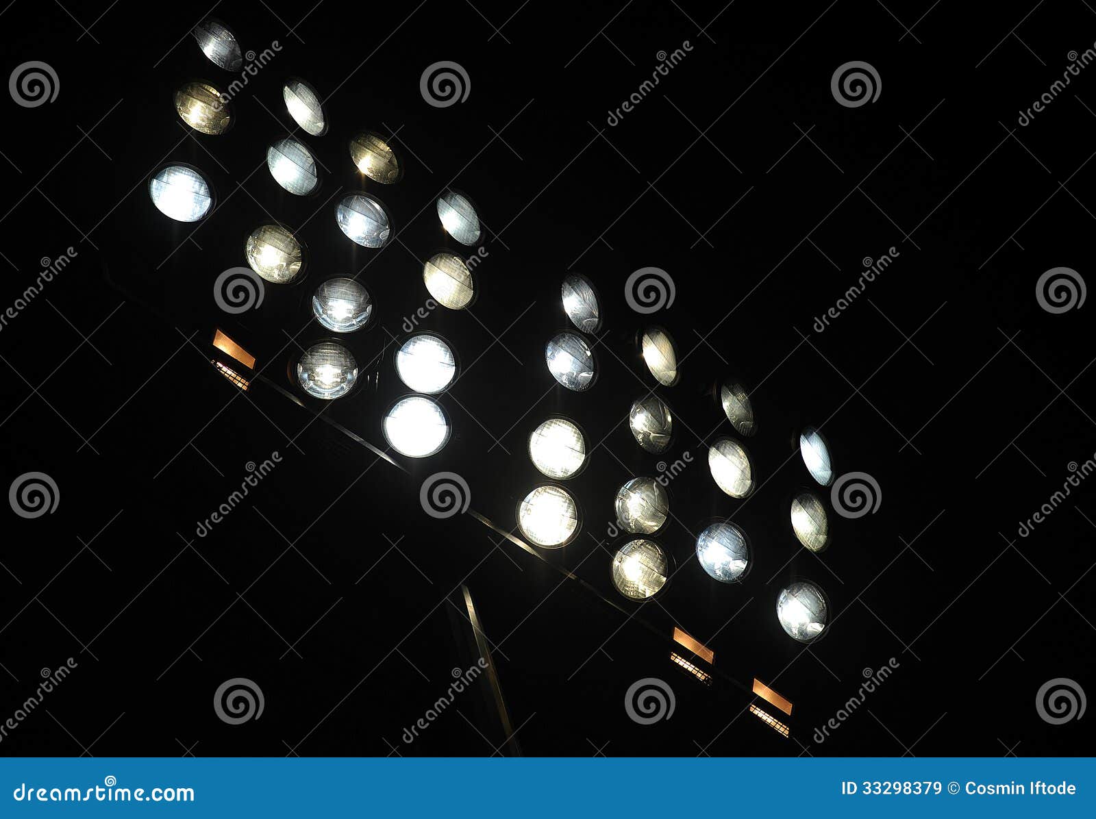 football stadium nocturne powerfull lights on dark background