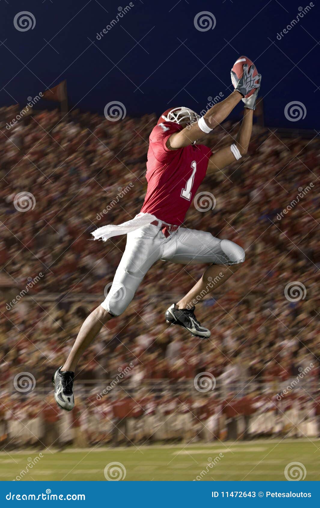football wide receiver making a leaping catch