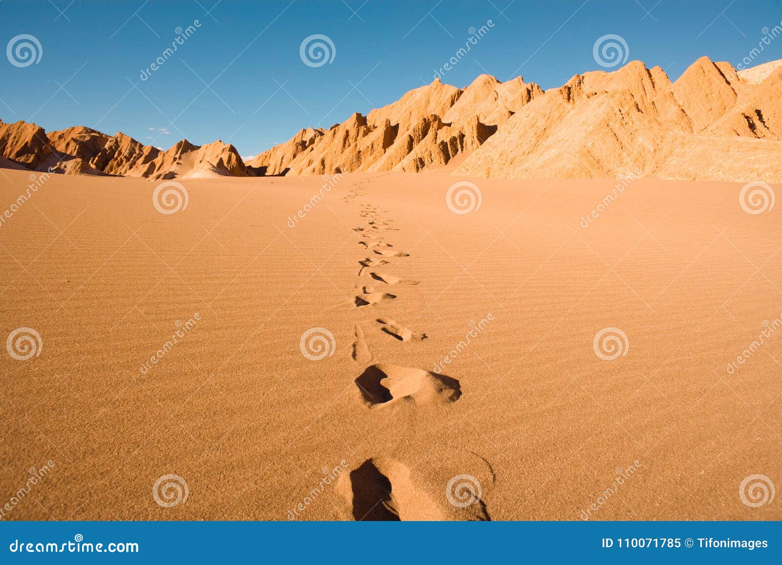 footprints at valle de la muerte in atacama desert