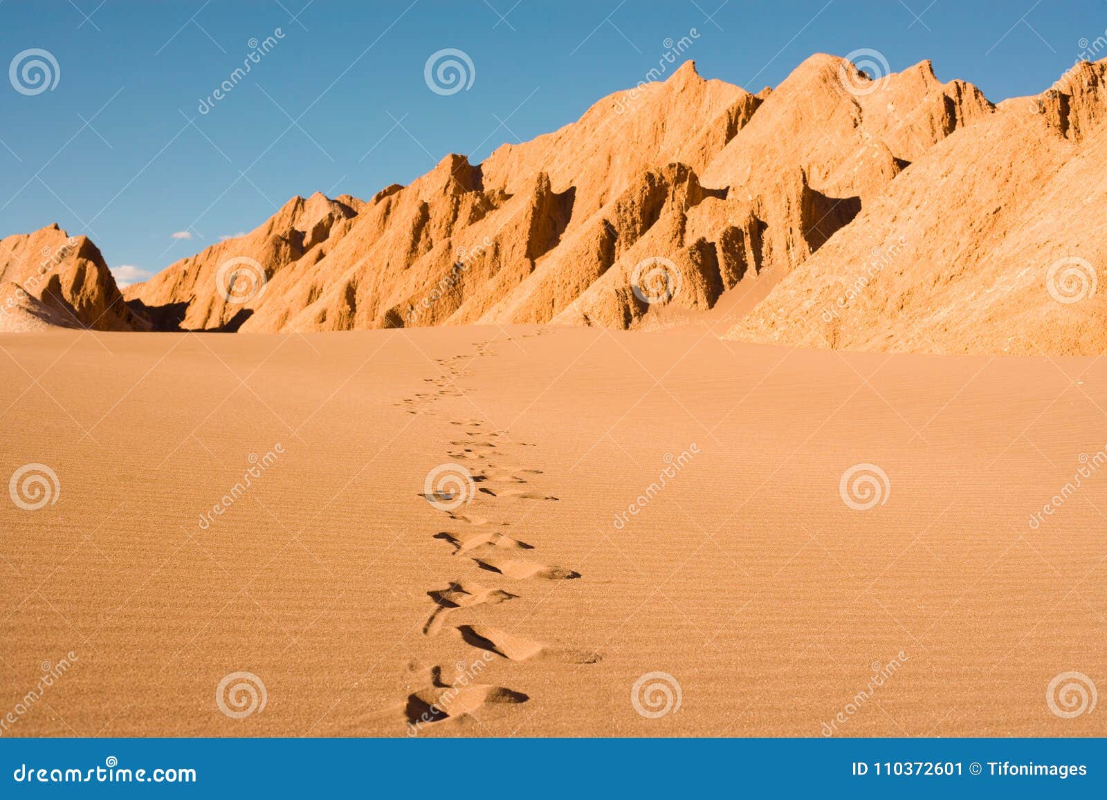 footprints at valle de la muerte in the atacama desert