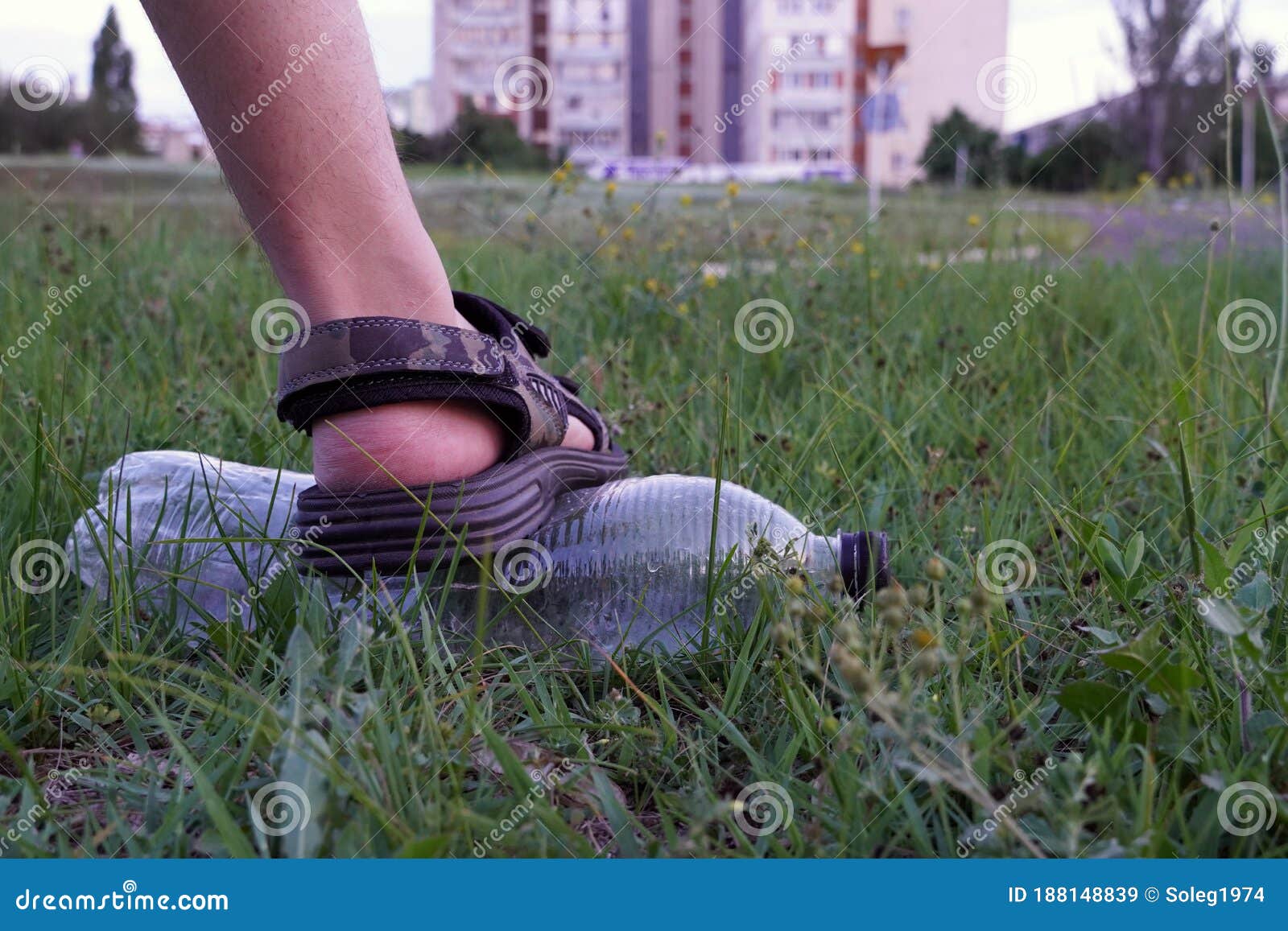 Foots and Used Plastic Bottle As Garbage on the Grass, Pollution ...