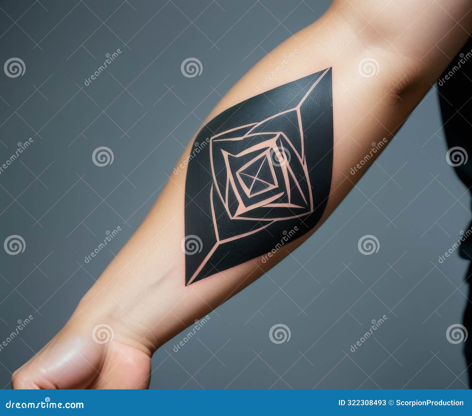 geometric black tattoo on forearm