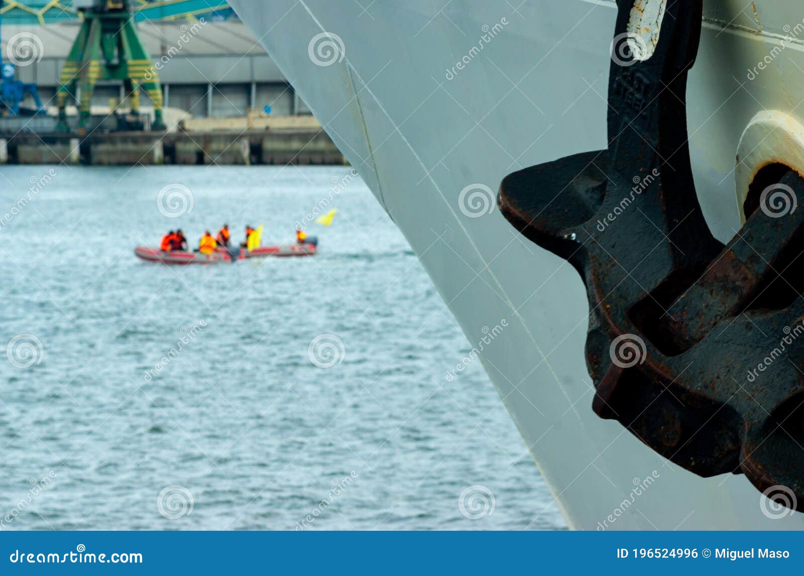 In the Foreground a Large Boat Anchor, and in the Background a Small