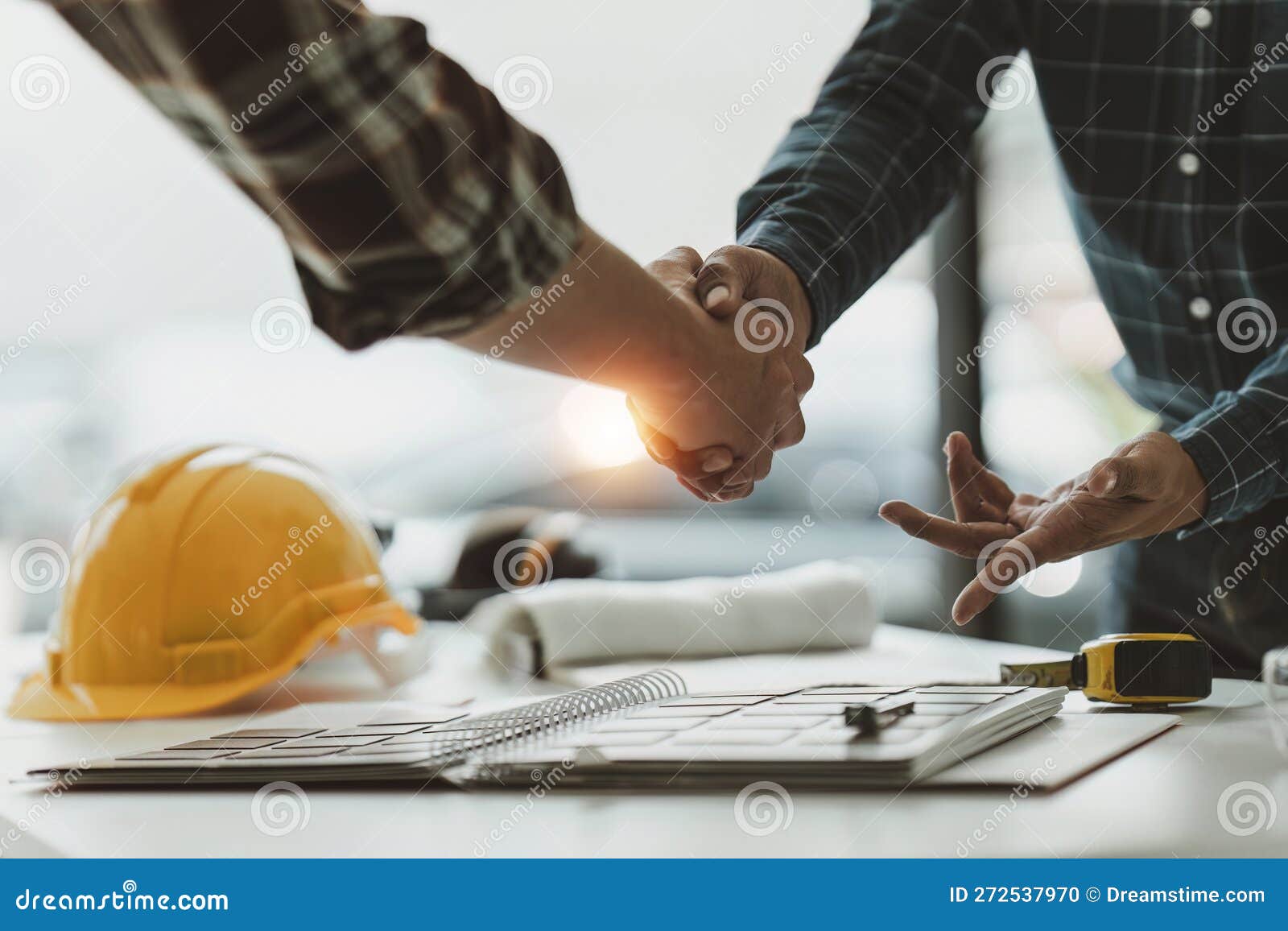 Foreman or Civil Engineer Handshake Making Modern Construction