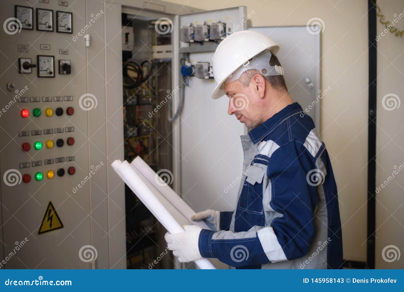 Foreman Electrician Next To the Dashboard. Energy and Electrical Safety