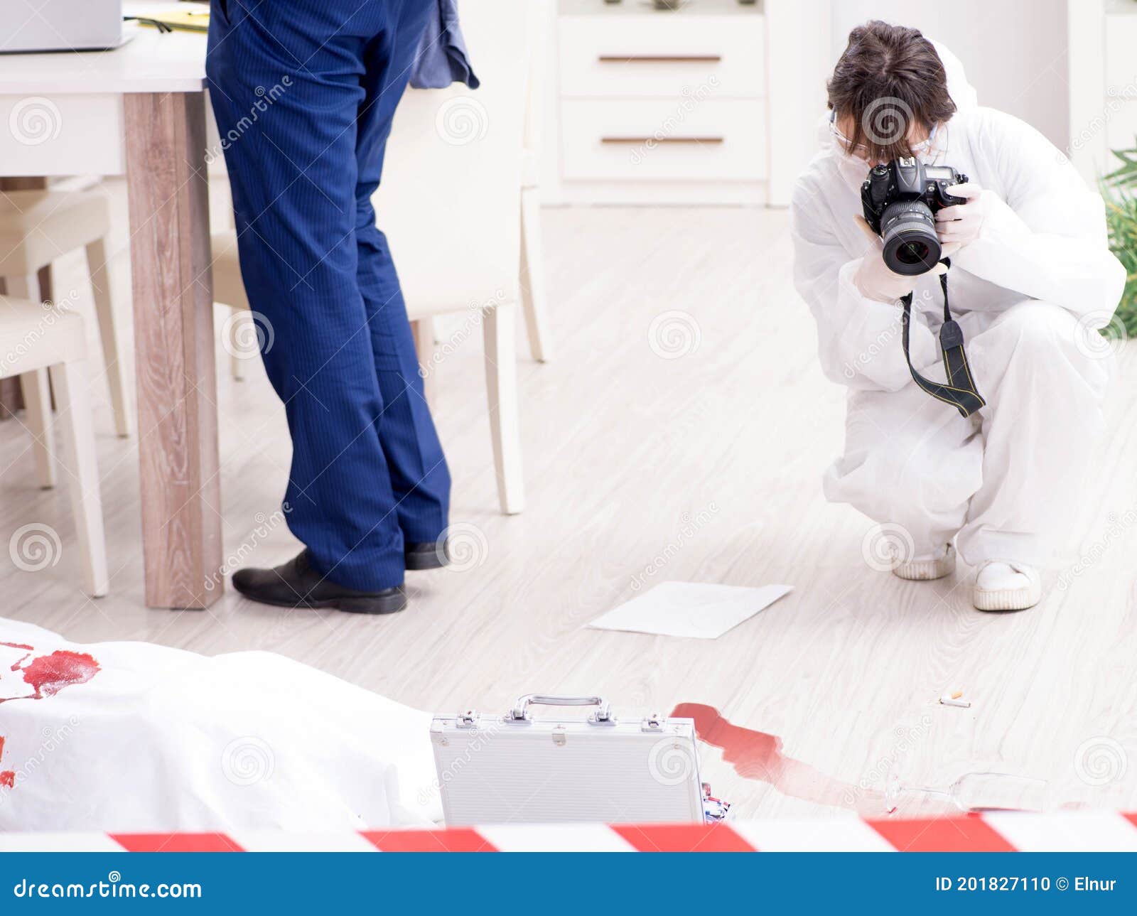 Forensics Investigator at the Scene of Office Crime Stock Photo Image