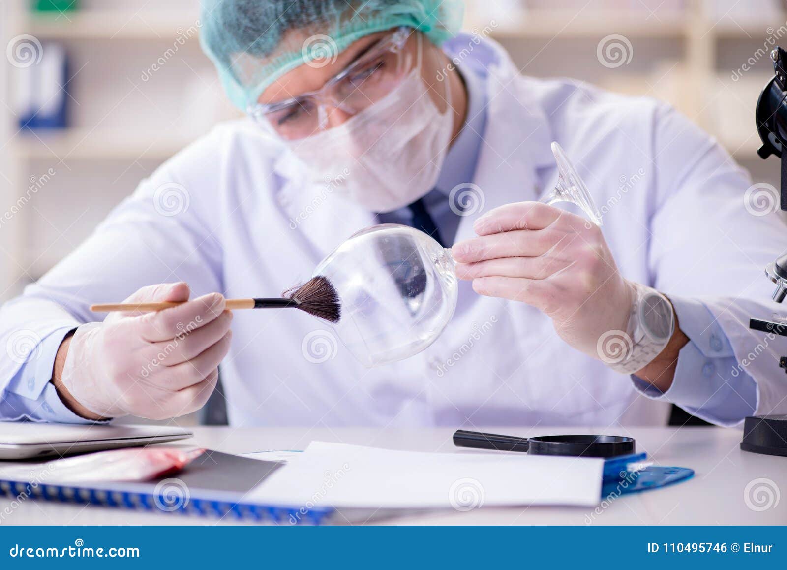 the forensics investigator working in lab on crime evidence