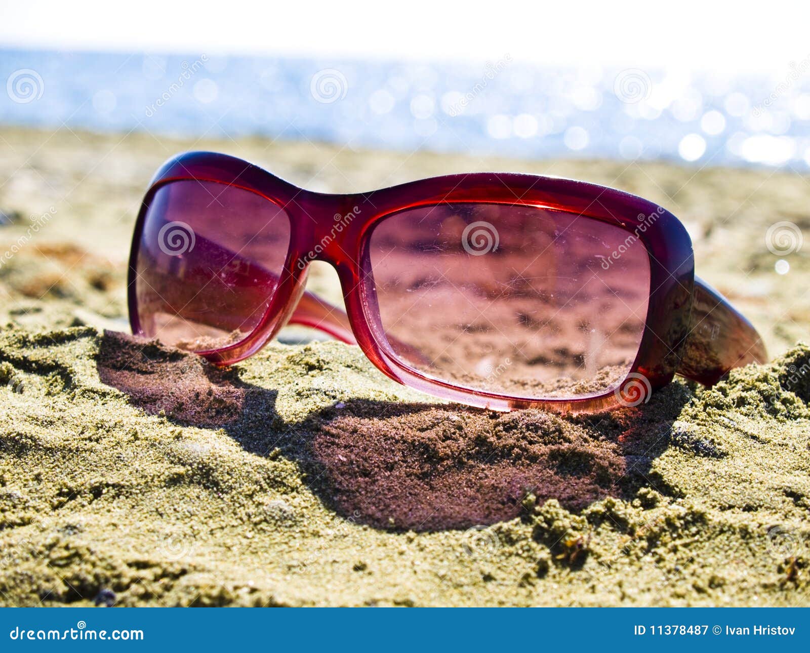 Forgotten Sunglasses on the Beach Stock Image - Image of dark, rays ...
