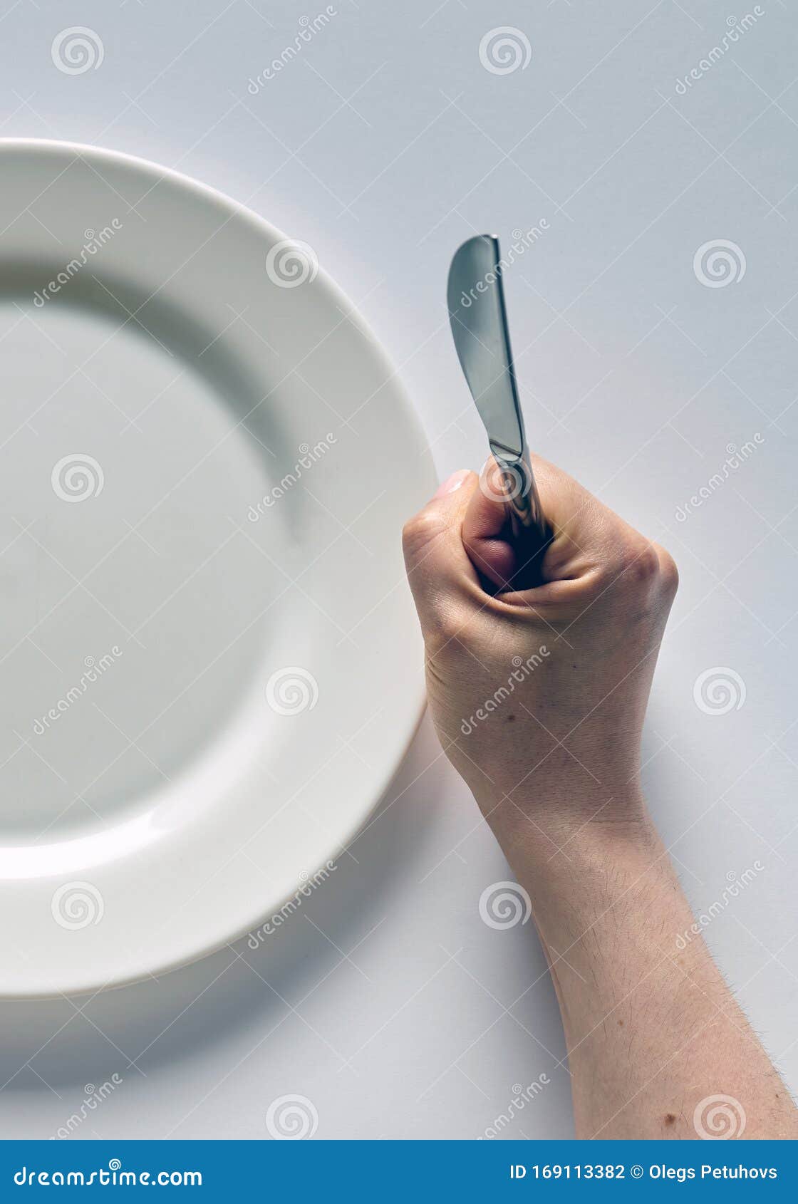 Fork And Knife In Hands On White Background With White Plate Stock