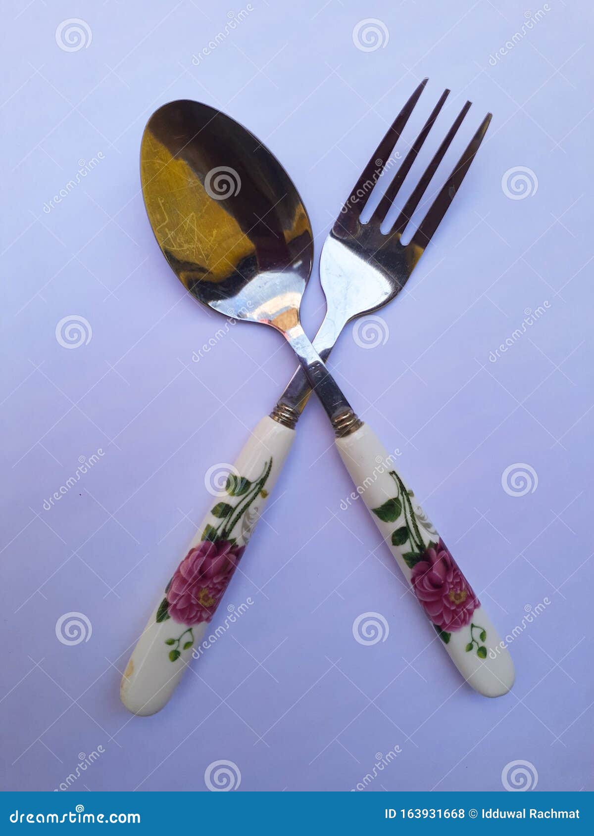 Fork and Spoon Cross Each Other Stock Photo Image of background