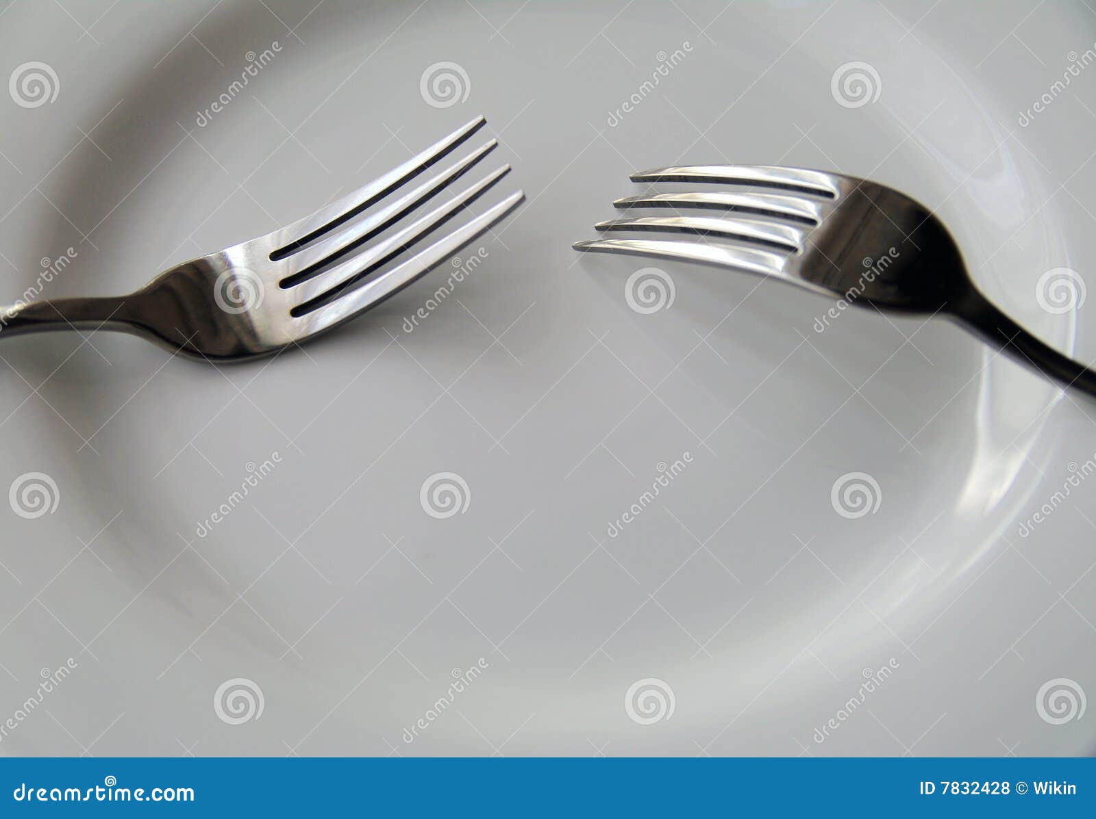 Forks on plate stock photo. Image of porcelain, plate 7832428