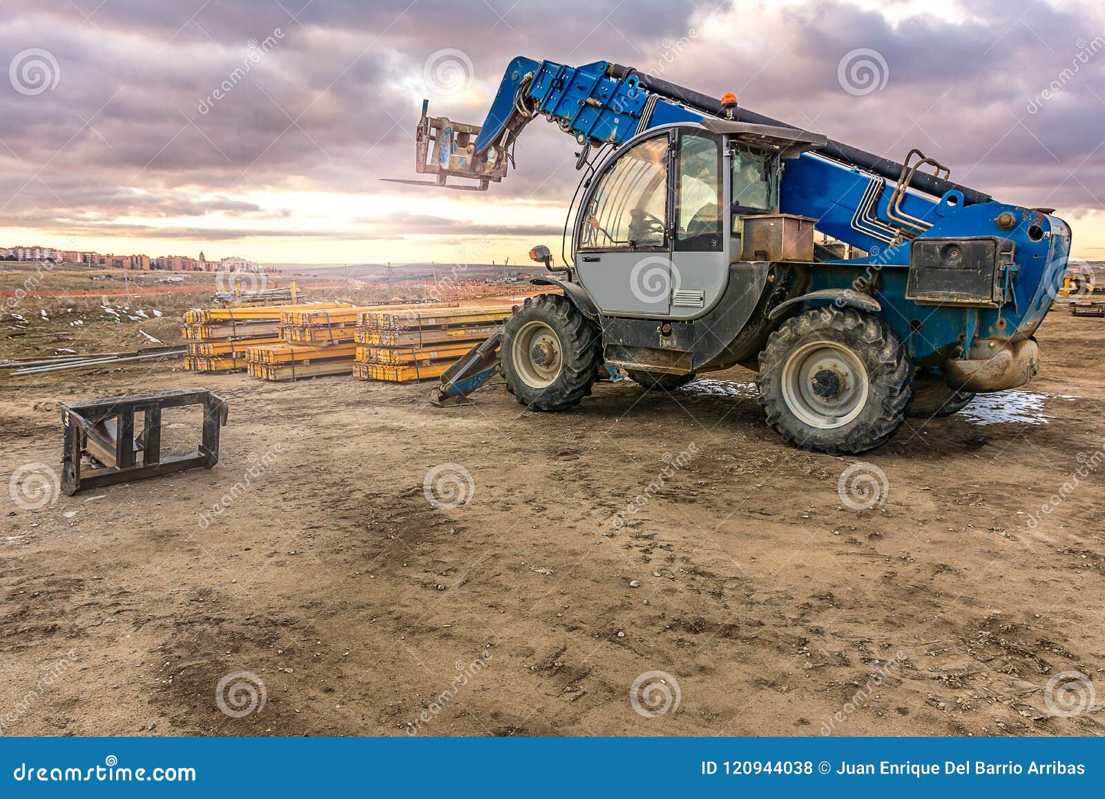 forklift on a construction site, preparing to raise construction parts