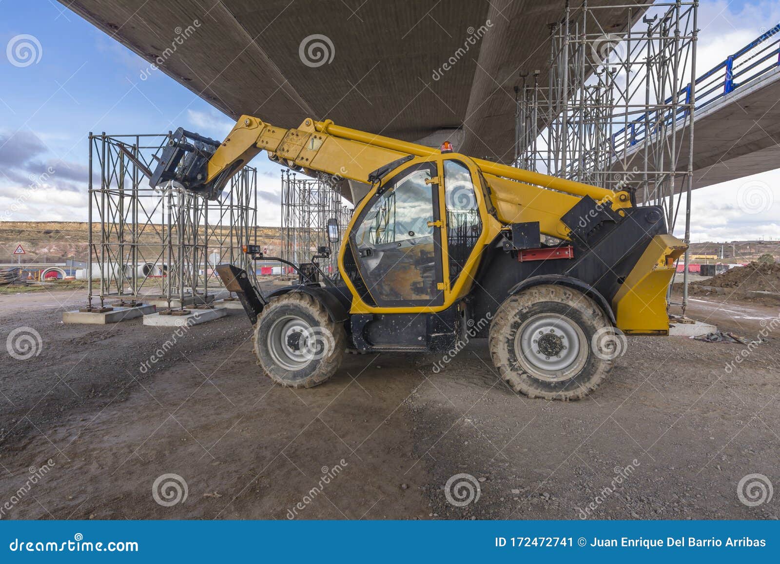 Forklift on a Construction Site, Preparing To Raise Construction Parts