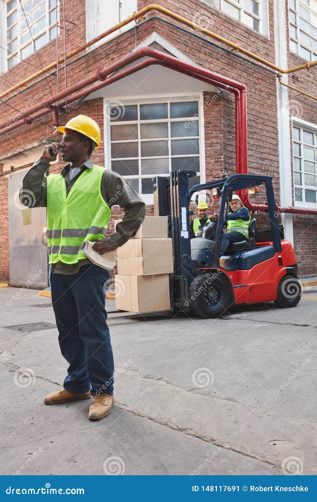 Forklift in Front of the Depot of a Logistics Company Stock Image