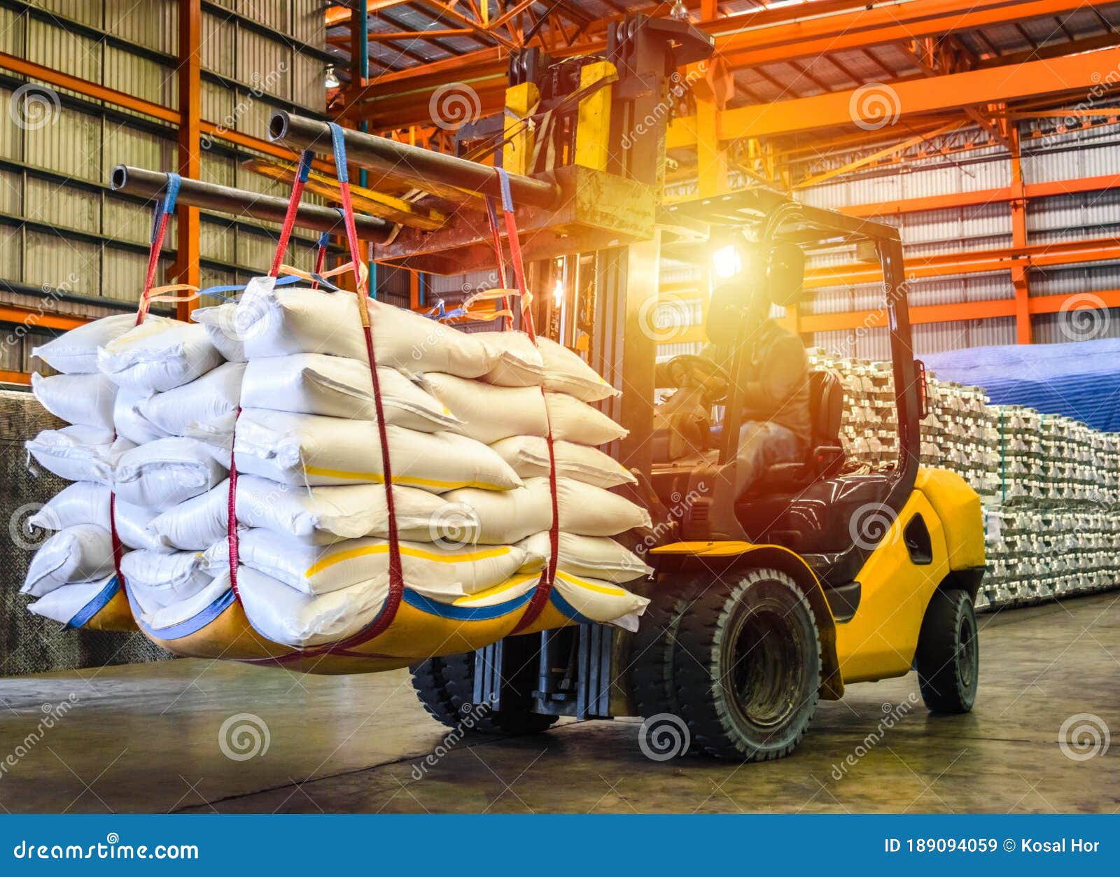 forklift handling sugar bag for stuffing into container for export. distribution, logistics import export, warehouse operation.