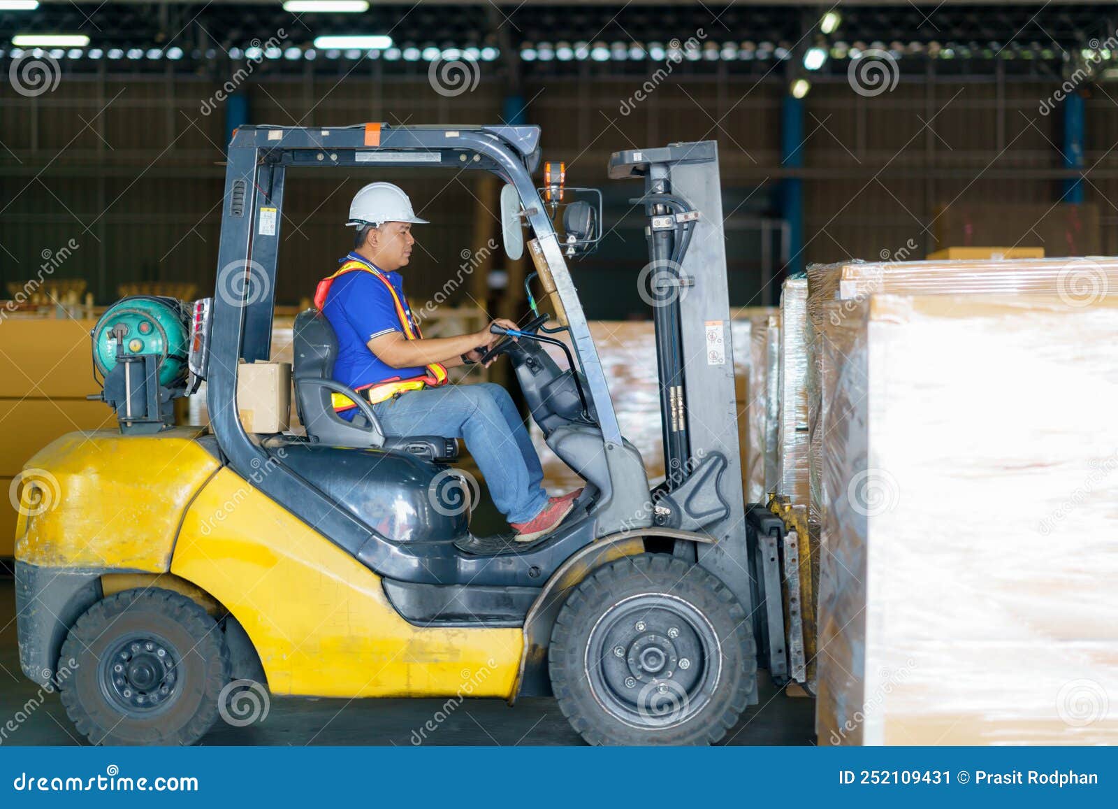 Forklift are Loading into Cargo Containers at Warehouses, Ports 