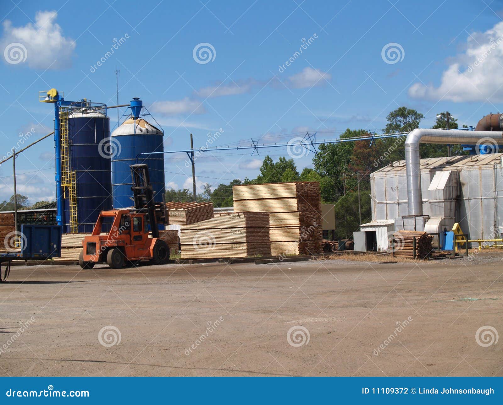 Forklift Moving Pallets in a South Lumber Stock Photo Image