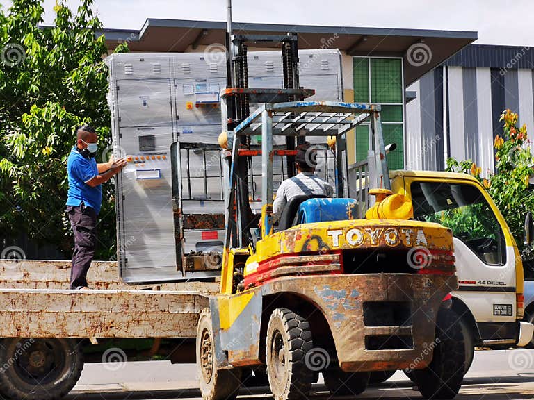 Forklift Operator Loading Switchboard at the Back of Lorry on June 6th 2020 at Kota Kinabalu