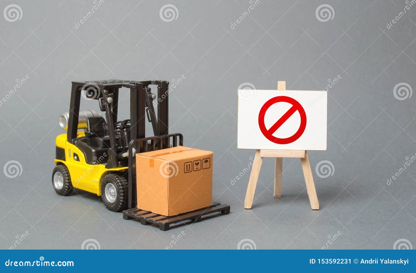 forklift truck carries a cardboard box near a stand with a red  no. no delivery. restriction on the importation of goods