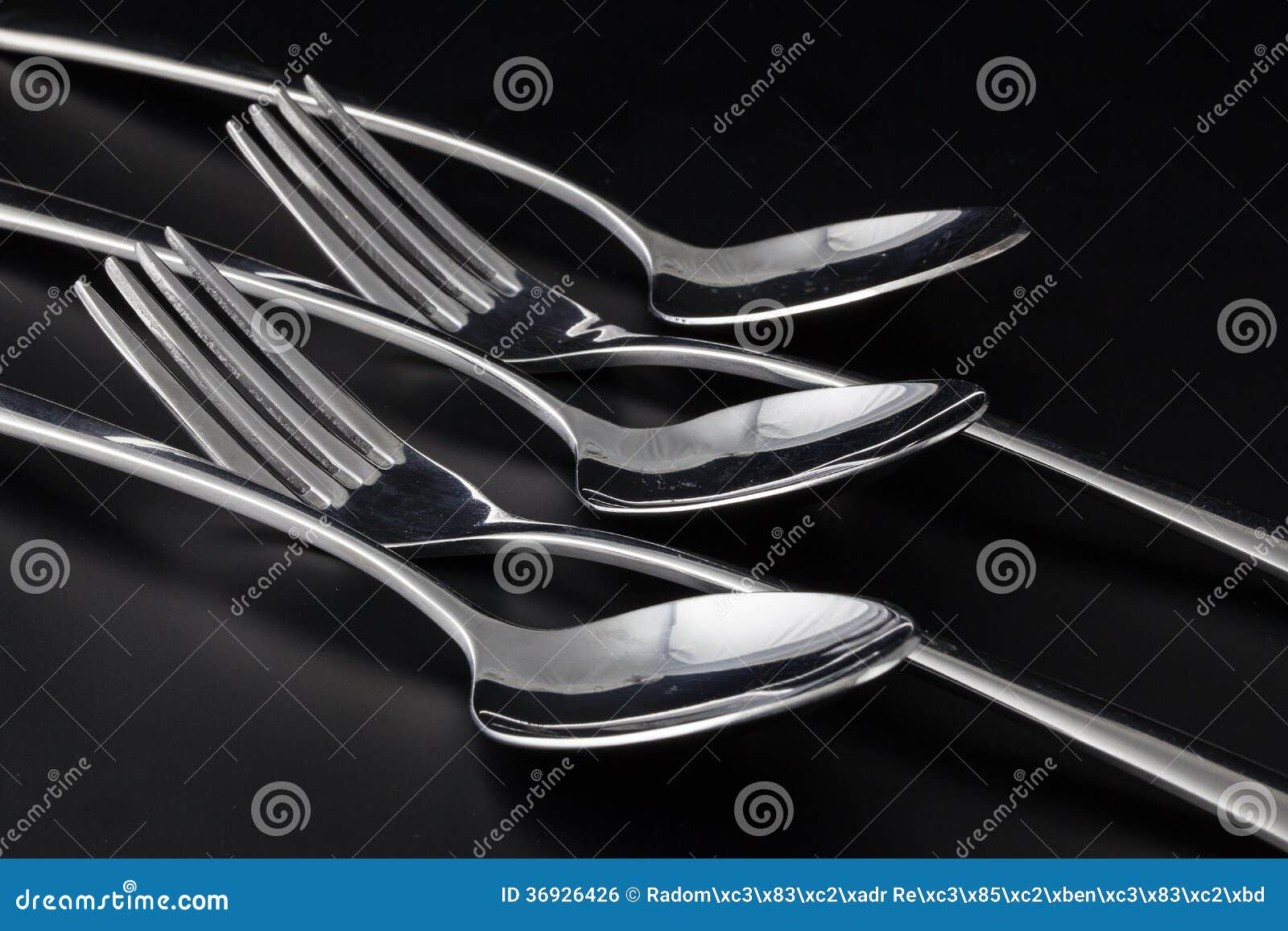 Forks and Spoons on a Black Table Stock Photo Image of spoon