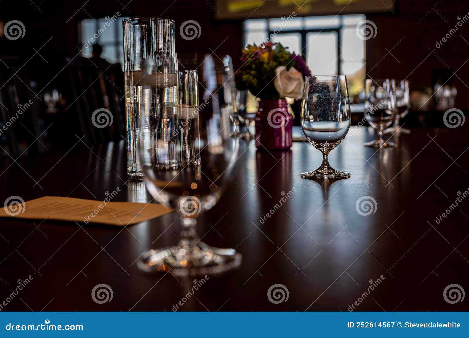 Formal Dinner Setting Placement with an Empty Glass and Light