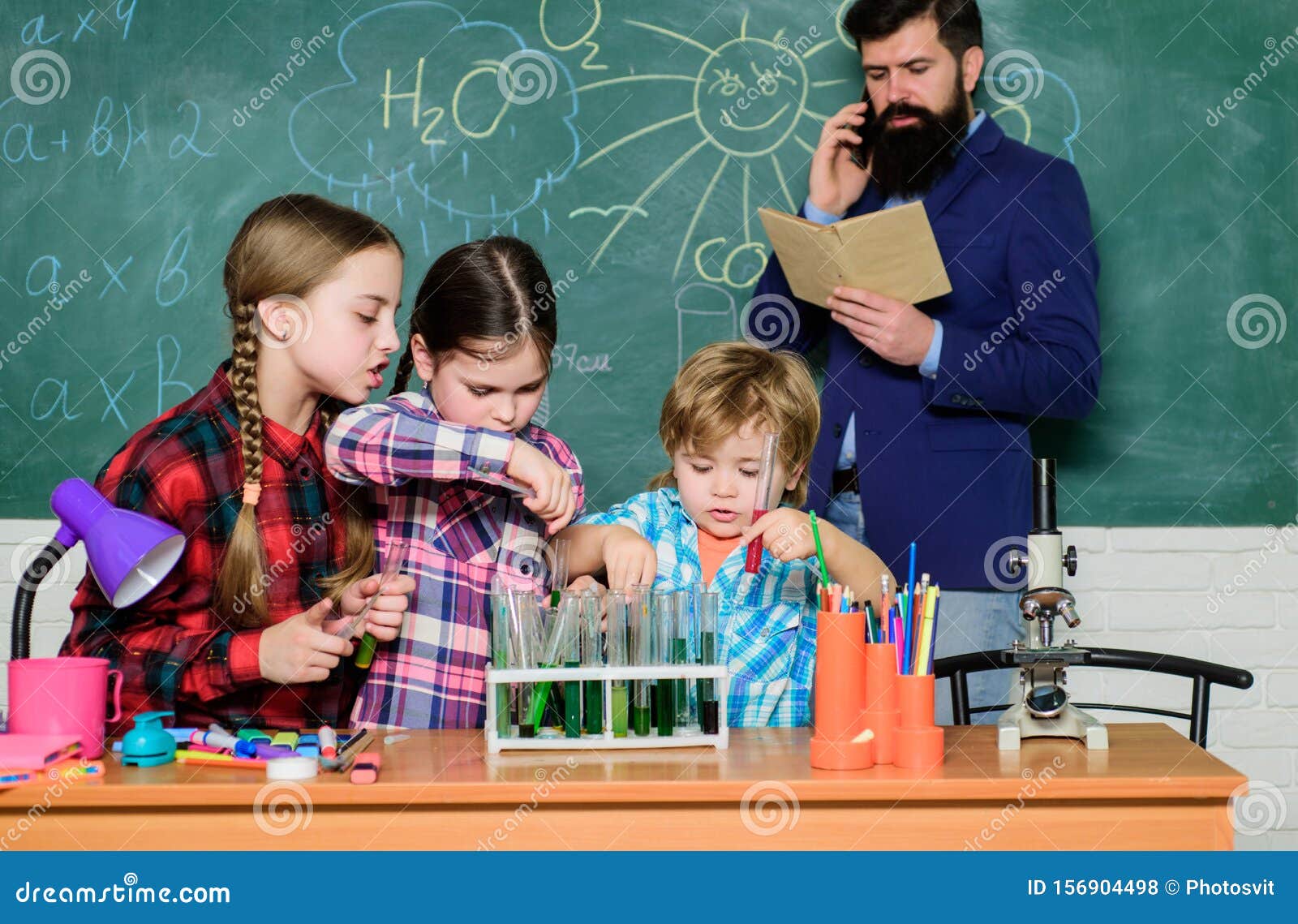 Chemistry Classes. Girls Classmates Study Chemistry. Microscope Test