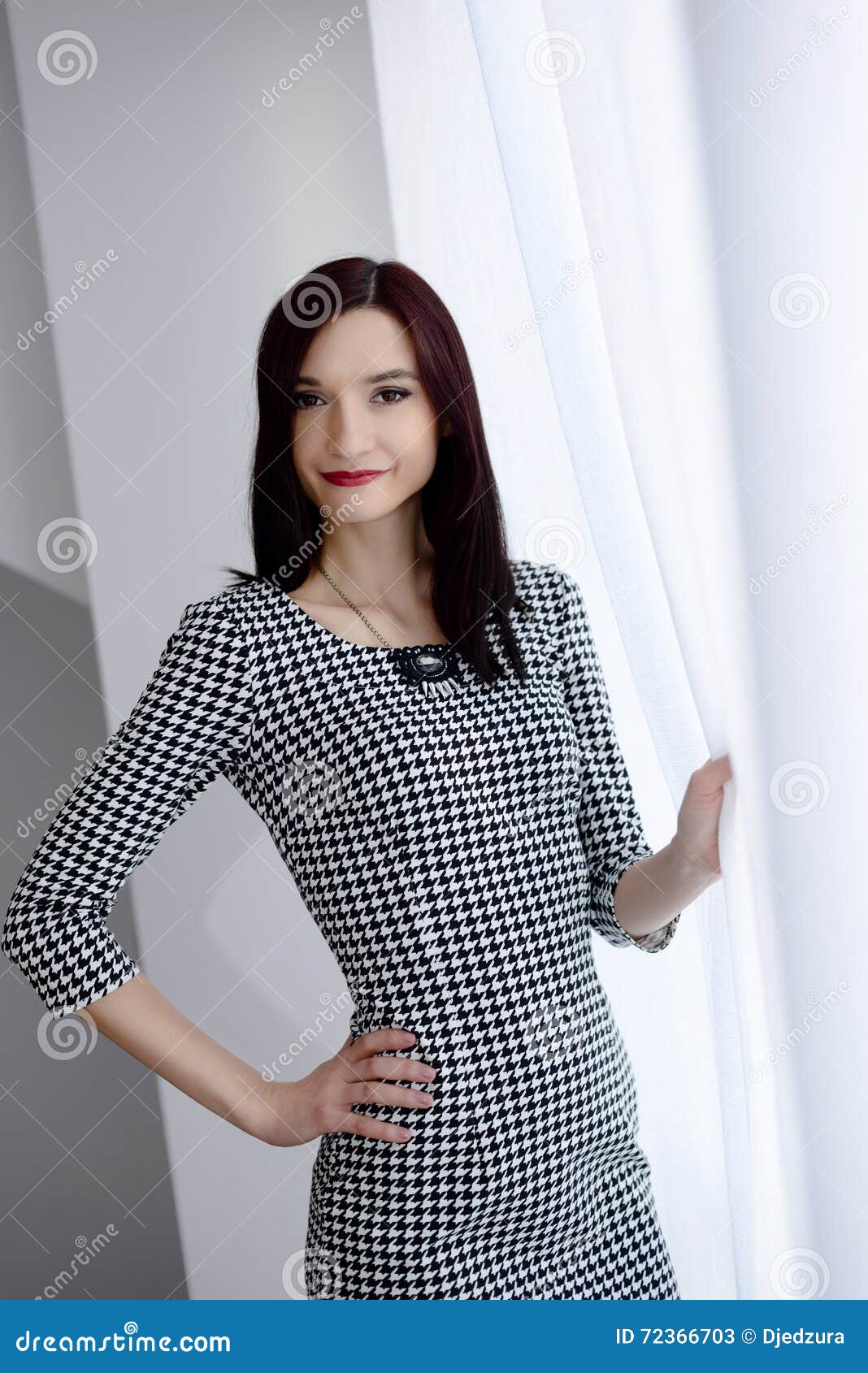 formally dressed young brunette woman