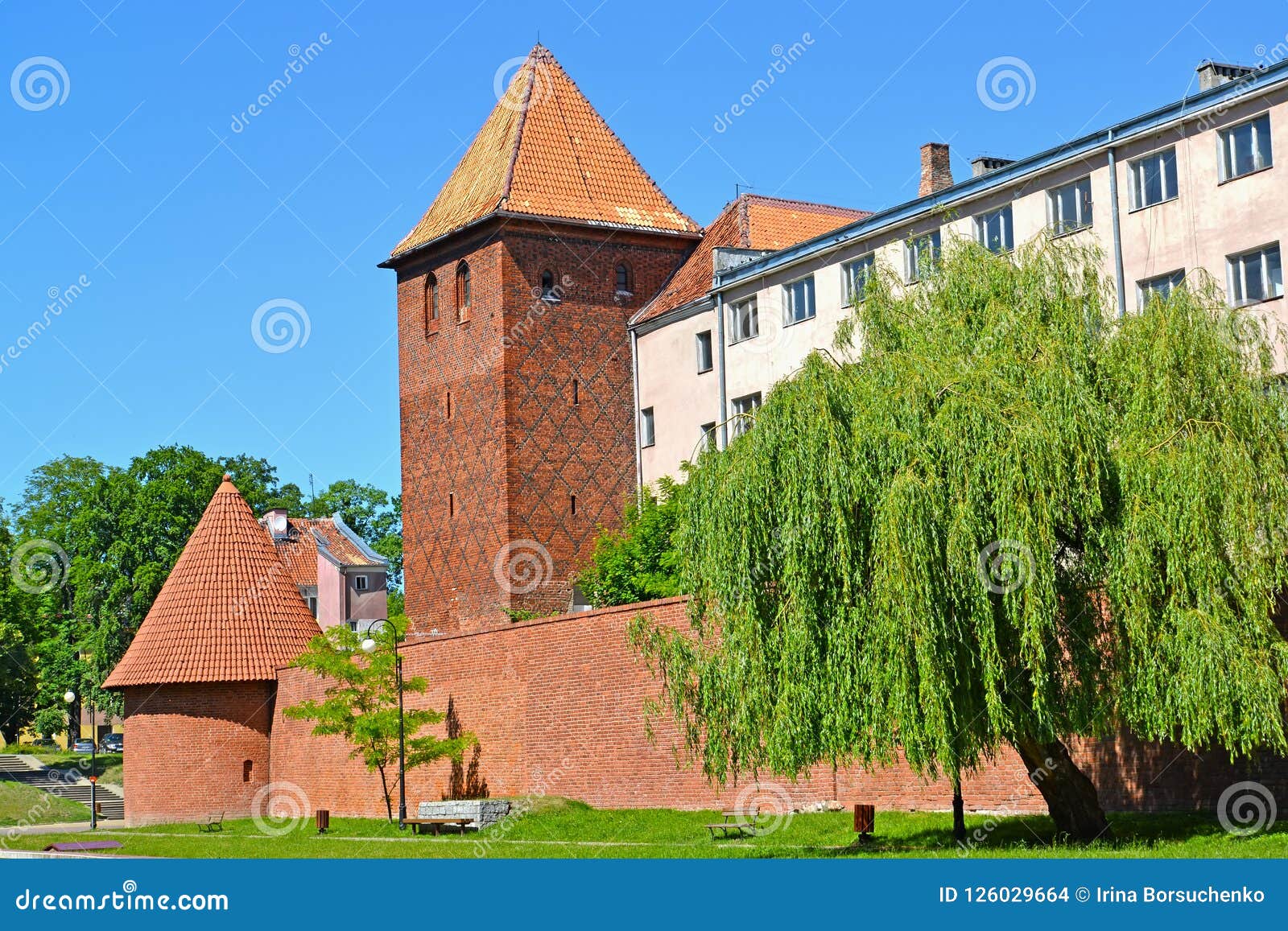 fortification, watchtower and gymnasium of jesuits in the summer afternoon. braniewo, poland