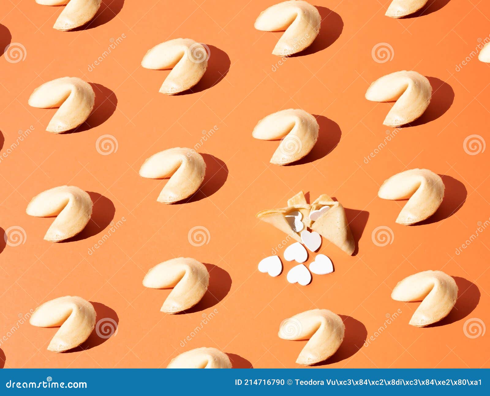 Fortune Cookies on an Orange Background with One Broken Fortune Cookie