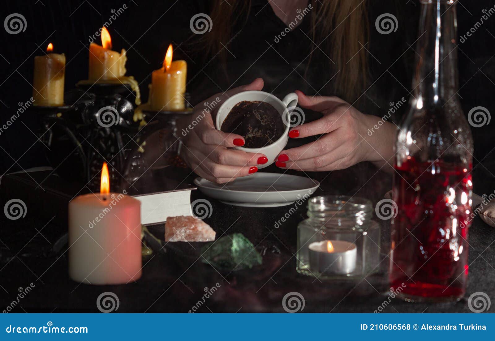 on Coffee Grounds. a Fortune Teller`s Hands, a Cup of