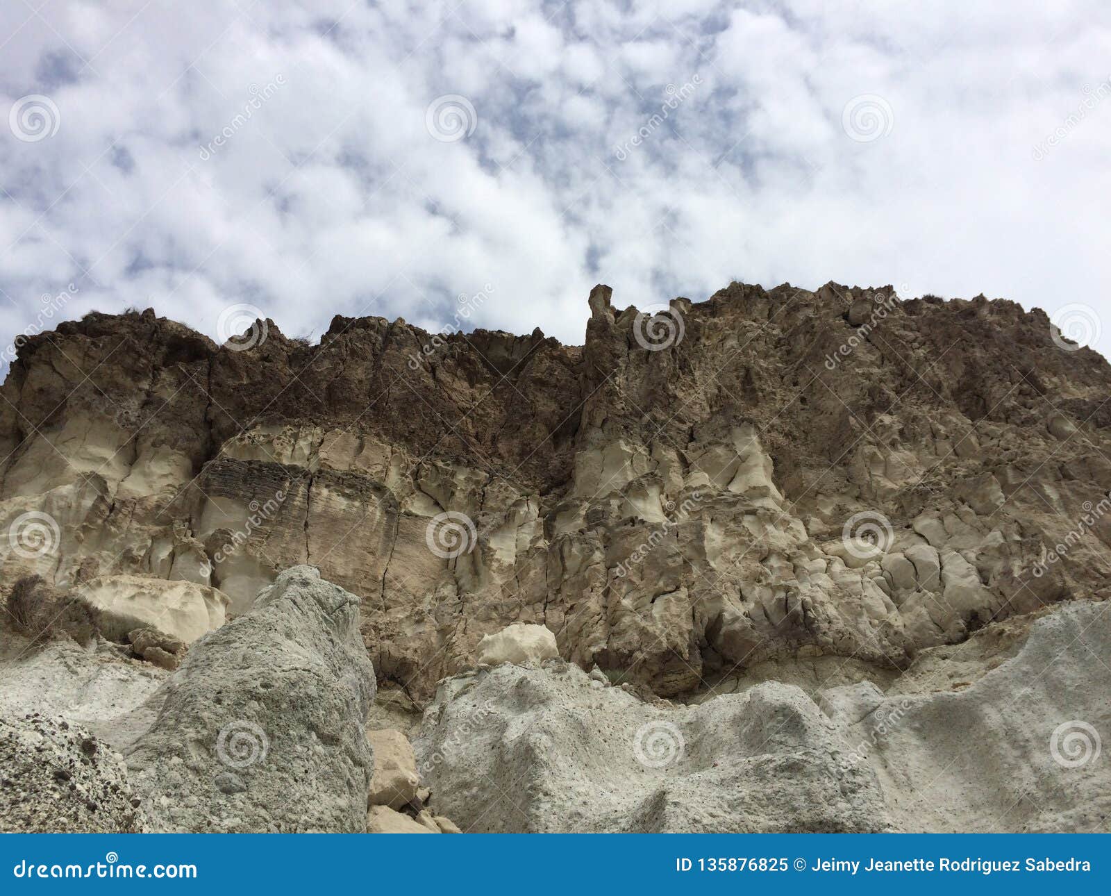 fossilized dunes with cloudy sky behind