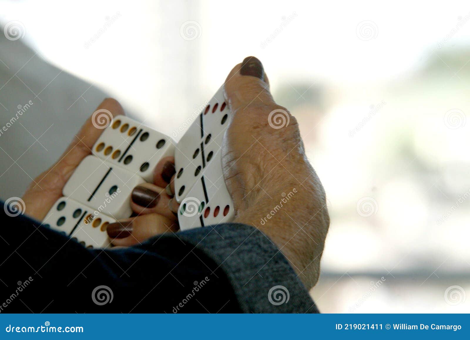 elderly woman playing dominoes in an asylum in brazil. elderly woman playing dominoes in an asylum in brazil. mulher idosa jogando