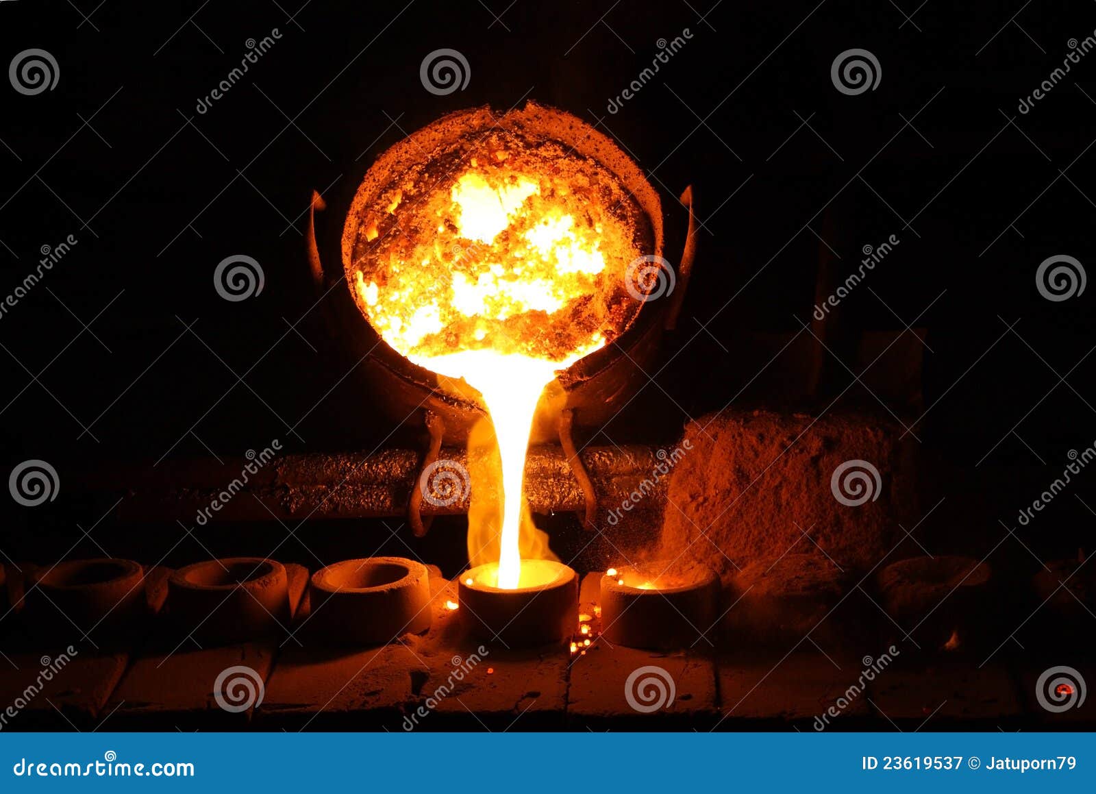 foundry - molten metal poured from ladle