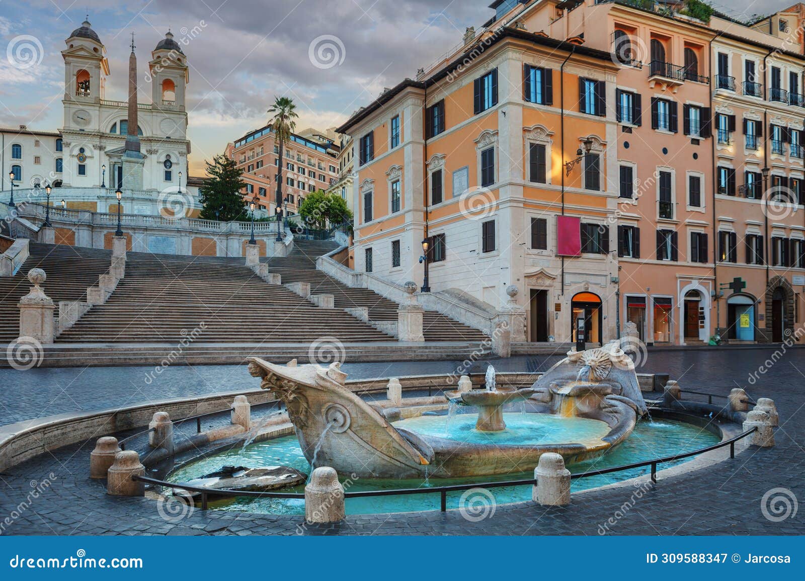 fountain of boat and spanish steps with trinita dei monti church in rome